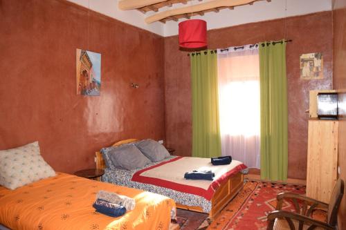 Imagen de la habitación del Hostal Kasbah Alta&iuml;r. Foto 11