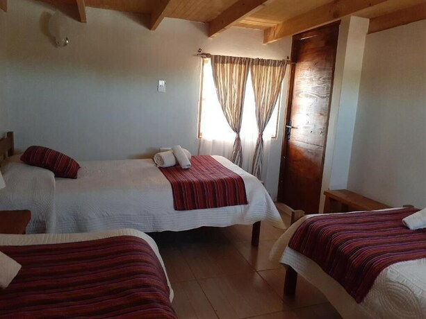Imagen de la habitación del Hostal Nuevo Amanecer. Foto 8
