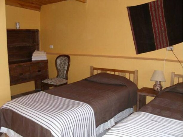 Imagen de la habitación del Hostal Nuevo Amanecer. Foto 12