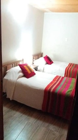 Imagen de la habitación del Hostal Nuevo Amanecer. Foto 14