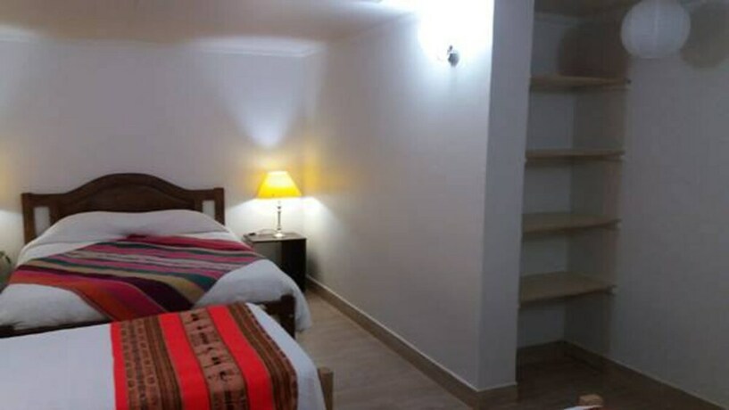 Imagen de la habitación del Hostal Nuevo Amanecer. Foto 15