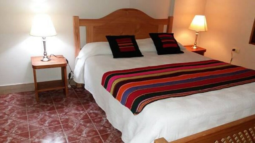 Imagen de la habitación del Hostal Nuevo Amanecer. Foto 17