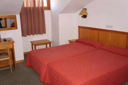 Imagen de la habitación del Hostal OYO Hostal La Posada. Foto 6