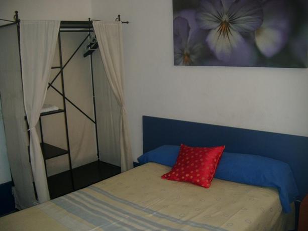 Imagen de la habitación del Hostal Puerta del Sol Rooms. Foto 6