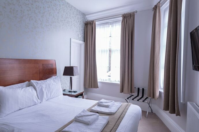 Imagen de la habitación del Hostal Qudos. Foto 13