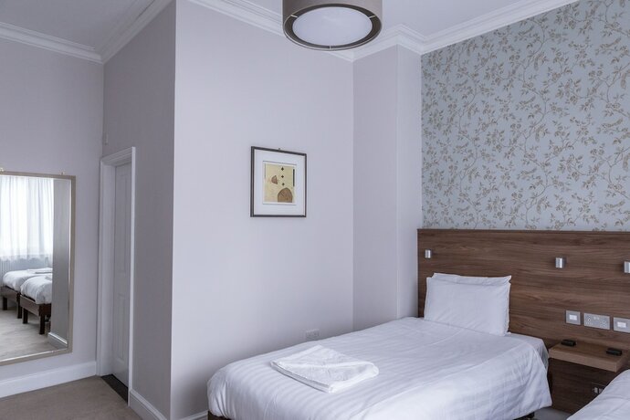 Imagen de la habitación del Hostal Qudos. Foto 18