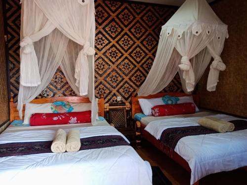 Imagen de la habitación del Hostal Tiing Bali Guest House Kintamani. Foto 7
