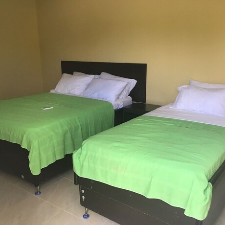 Imagen de la habitación del Hostal Victoria's Gennie Bay Village. Foto 12