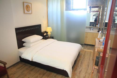 Imagen de la habitación del Hostel Beijing Pagoda Light International Youth. Foto 7