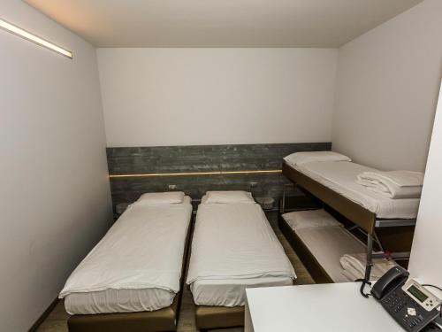 Imagen de la habitación del Hostel Campione Univela. Foto 8