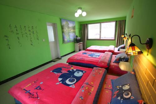 Imagen de la habitación del Hostel Fenghuang Fleeting Night. Foto 7