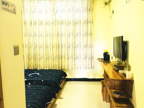 Imagen de la habitación del Hostel Fenghuang Relay Sunshine. Foto 7