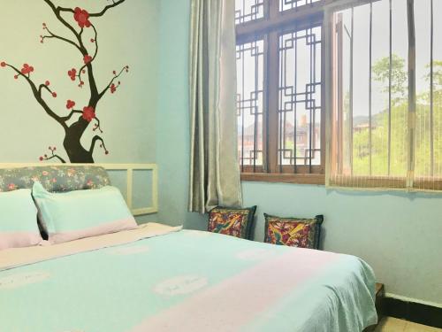 Imagen general del Hostel Fenghuang Relay Sunshine. Foto 2