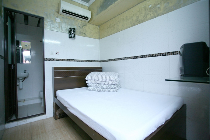 Imagen de la habitación del Hostel H.k Commercial Inn. Foto 2