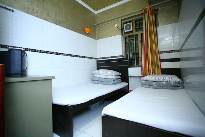 Imagen de la habitación del Hostel H.k Commercial Inn. Foto 4