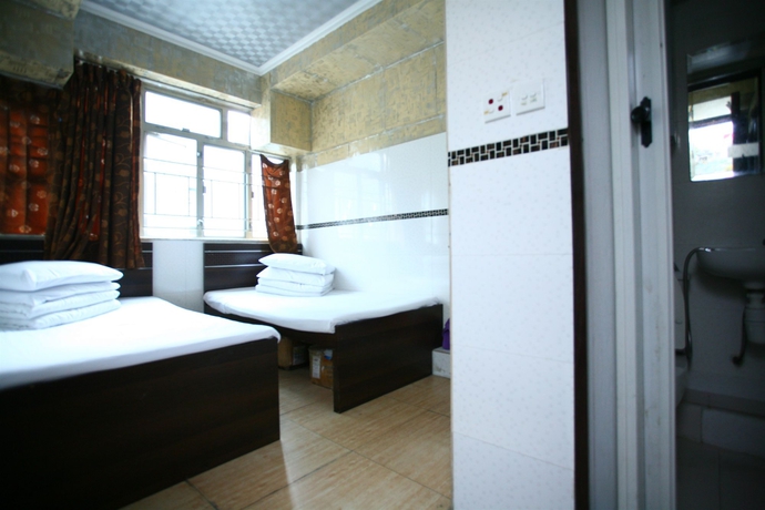 Imagen de la habitación del Hostel H.k Commercial Inn. Foto 6
