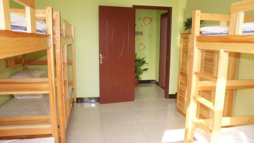 Imagen de la habitación del Hostel Huashan Hua Yi International Youth. Foto 6