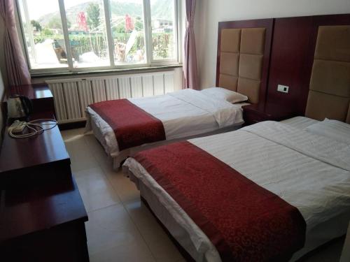 Imagen de la habitación del Hostel Jin Xin. Foto 4