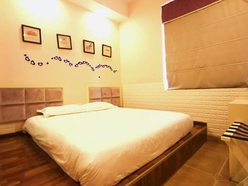 Imagen de la habitación del Hostel Leshan Haiyun International Youth. Foto 8