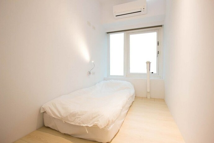 Imagen de la habitación del Hostel Light Inn -. Foto 29