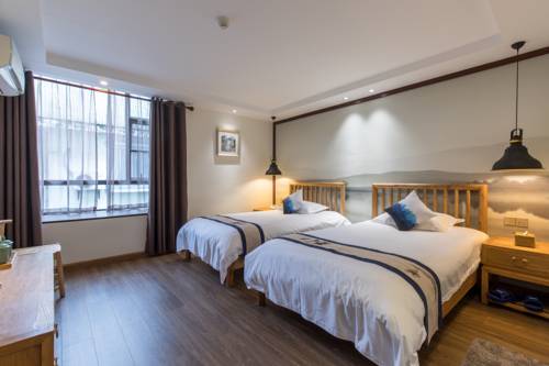 Imagen de la habitación del Hostel Riverside Inn Guilin Central. Foto 3