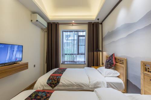 Imagen de la habitación del Hostel Riverside Inn Guilin Central. Foto 6