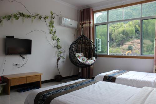 Imagen de la habitación del Hostel Sanqingshan Mountain House Youth. Foto 6