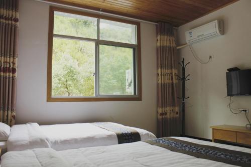 Imagen de la habitación del Hostel Sanqingshan Mountain House Youth. Foto 9