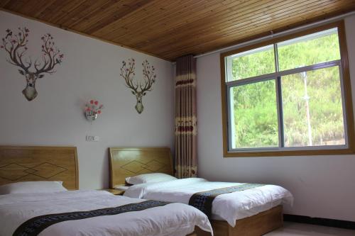 Imagen de la habitación del Hostel Sanqingshan Mountain House Youth. Foto 10