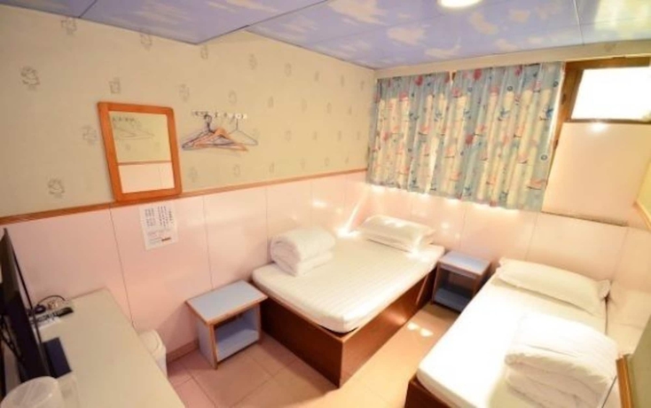 Imagen de la habitación del Hostel Wing Wah. Foto 12
