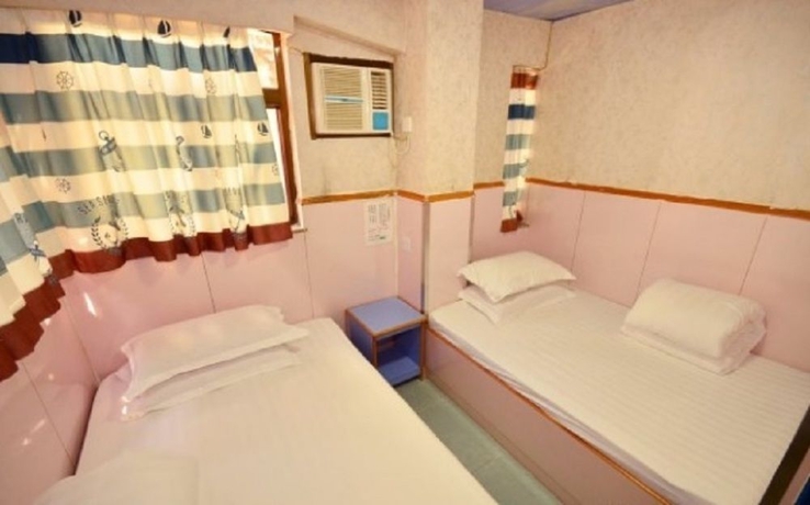Imagen de la habitación del Hostel Wing Wah. Foto 13