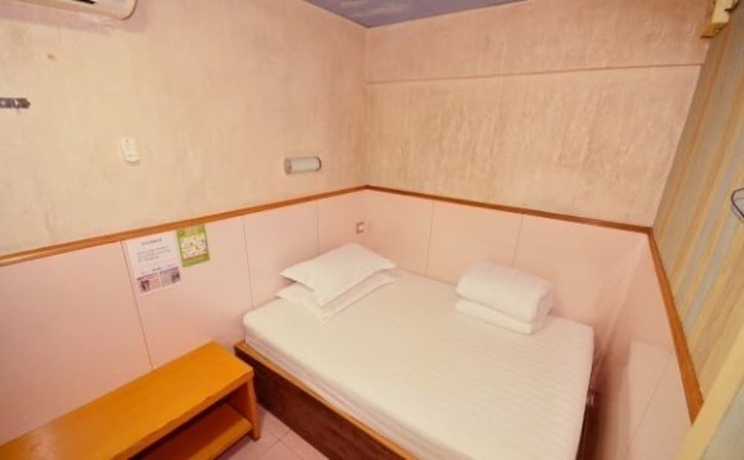 Imagen de la habitación del Hostel Wing Wah. Foto 14