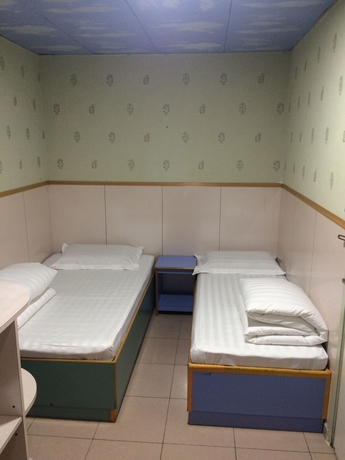Imagen de la habitación del Hostel Wing Wah. Foto 15