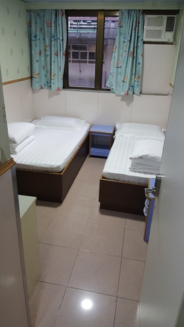 Imagen de la habitación del Hostel Wing Wah. Foto 16