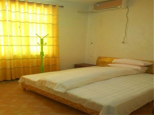 Imagen de la habitación del Hostel Wuyuan Jiangling Huatian. Foto 8