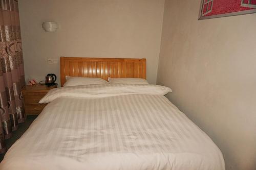 Imagen de la habitación del Hostel Yun Shui Yao Dong Bi Lou. Foto 6