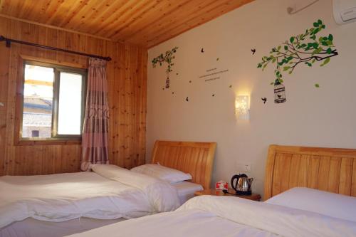 Imagen de la habitación del Hostel Yun Shui Yao Dong Bi Lou. Foto 7