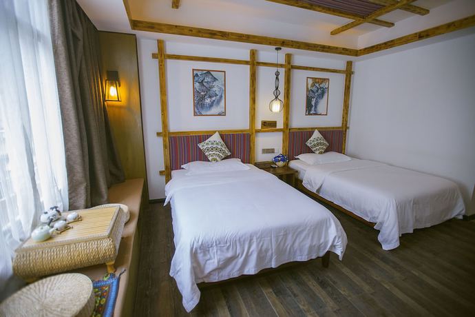 Imagen de la habitación del Hostel Zhangjiajie Nanfang Yinan Hotel. Foto 6