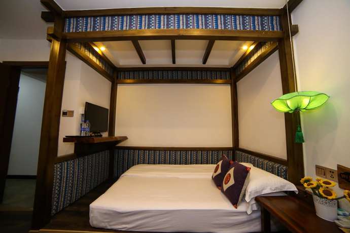 Imagen de la habitación del Hostel Zhangjiajie Nanfang Yinan Hotel. Foto 9