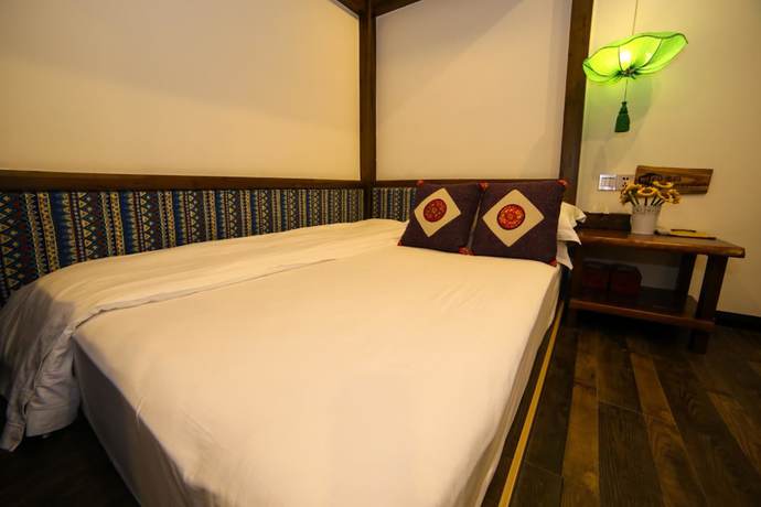 Imagen de la habitación del Hostel Zhangjiajie Nanfang Yinan Hotel. Foto 11