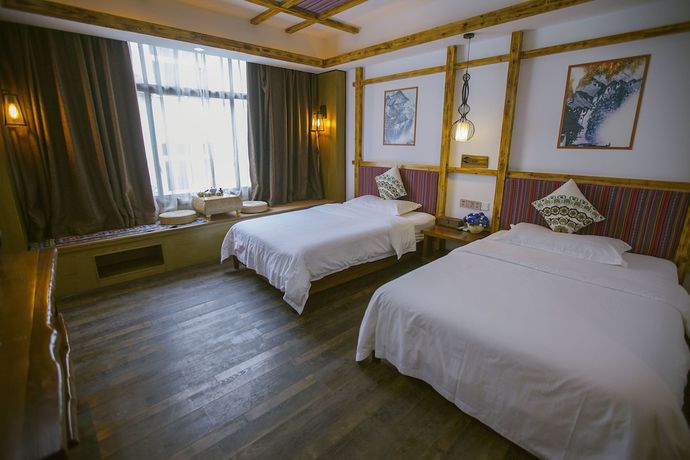 Imagen de la habitación del Hostel Zhangjiajie Nanfang Yinan Hotel. Foto 12