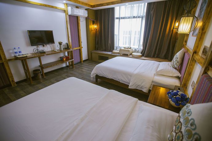 Imagen de la habitación del Hostel Zhangjiajie Nanfang Yinan Hotel. Foto 13