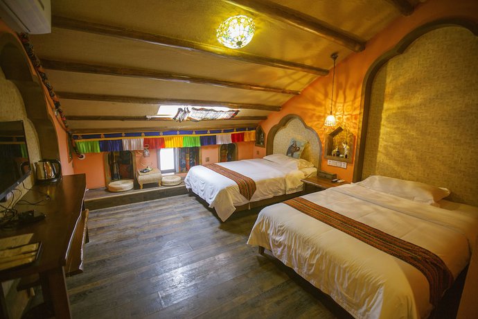 Imagen de la habitación del Hostel Zhangjiajie Nanfang Yinan Hotel. Foto 15