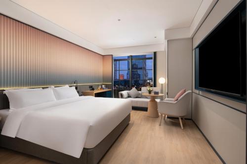 Imagen de la habitación del Hotel 广州番禺万博中心舒与酒店. Foto 18