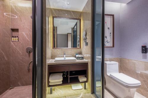 Imagen de la habitación del Hotel 丽呈東谷酒店保定客运中心店. Foto 18