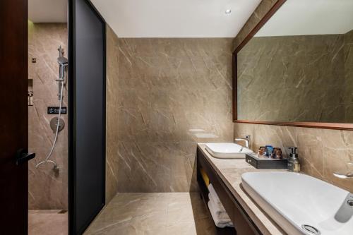 Imagen de la habitación del Hotel 丽呈東谷酒店保定客运中心店. Foto 19