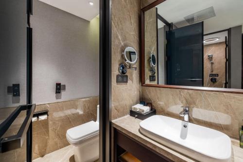 Imagen de la habitación del Hotel 丽呈東谷酒店保定客运中心店. Foto 20