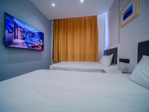 Imagen de la habitación del Hotel 浅予酒店 青岛北站店. Foto 17