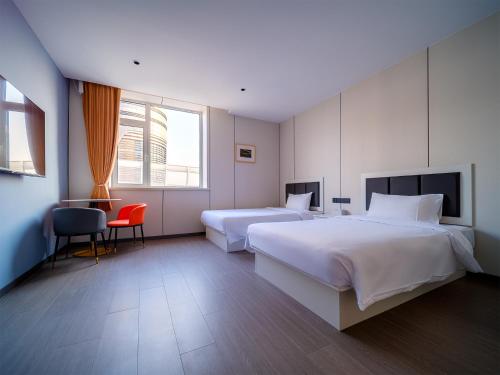 Imagen de la habitación del Hotel 浅予酒店 青岛北站店. Foto 18