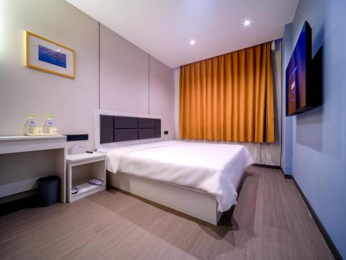 Imagen de la habitación del Hotel 浅予酒店 青岛北站店. Foto 20